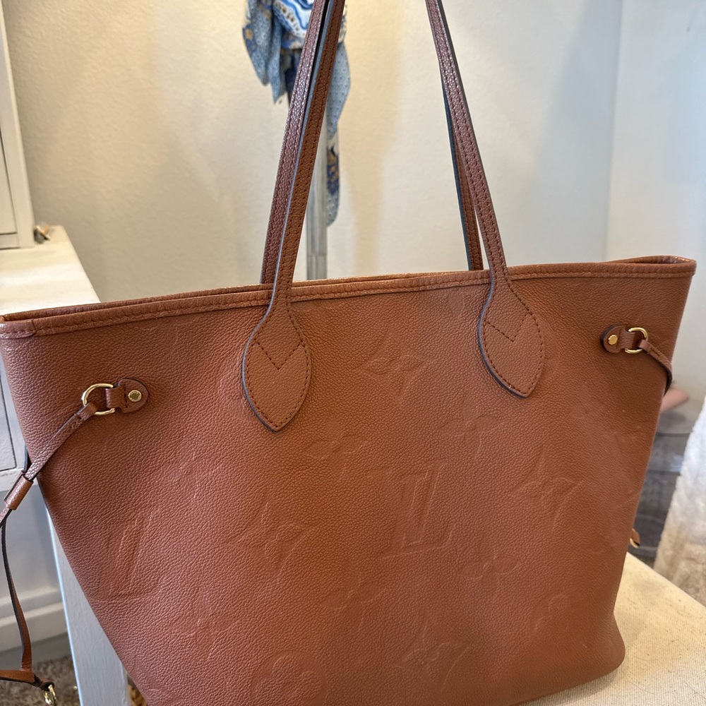 Louis Vuitton Cognac Monogram Purse & Clutch.
Like New condition. Discontinued.